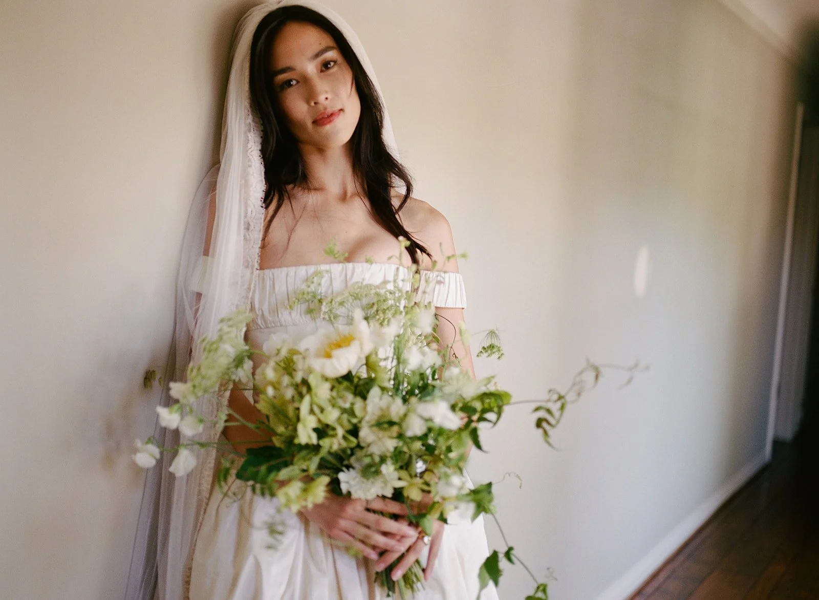Model bride poses for film portrait in Los Angeles, California.