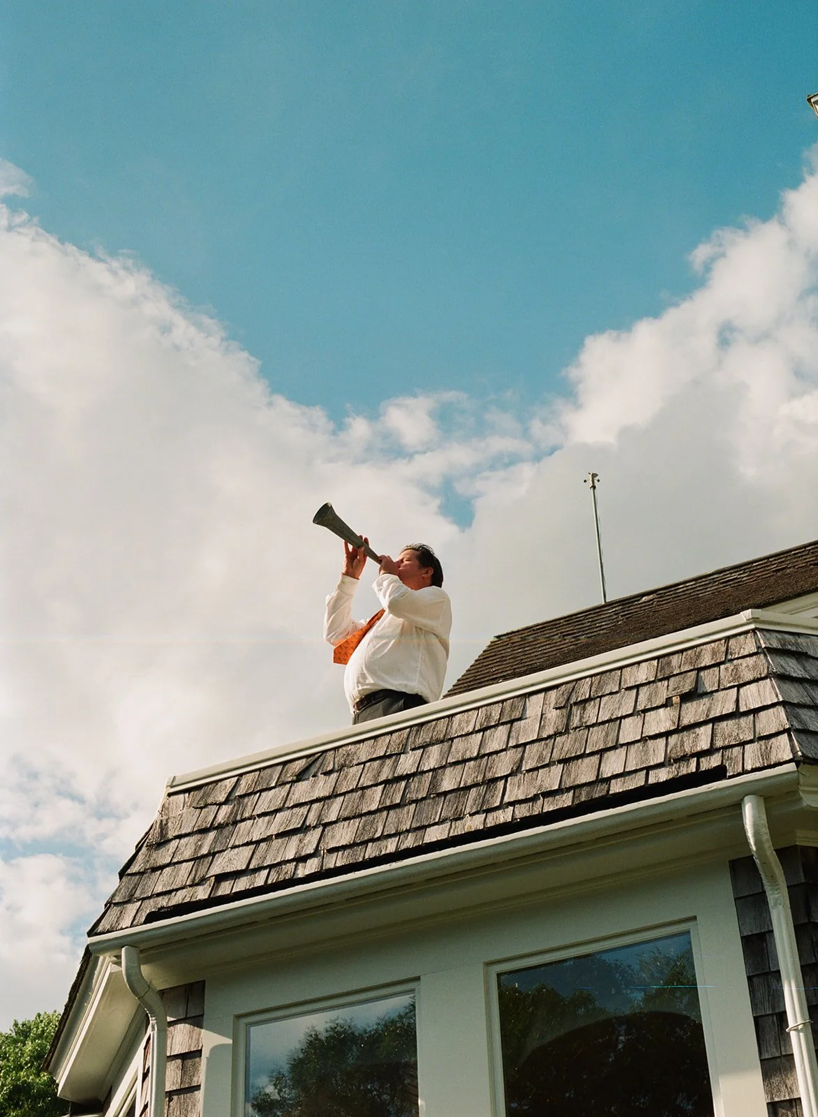 Dinner is announced for wedding reception at family home in Cape Cod, Massachusetts.