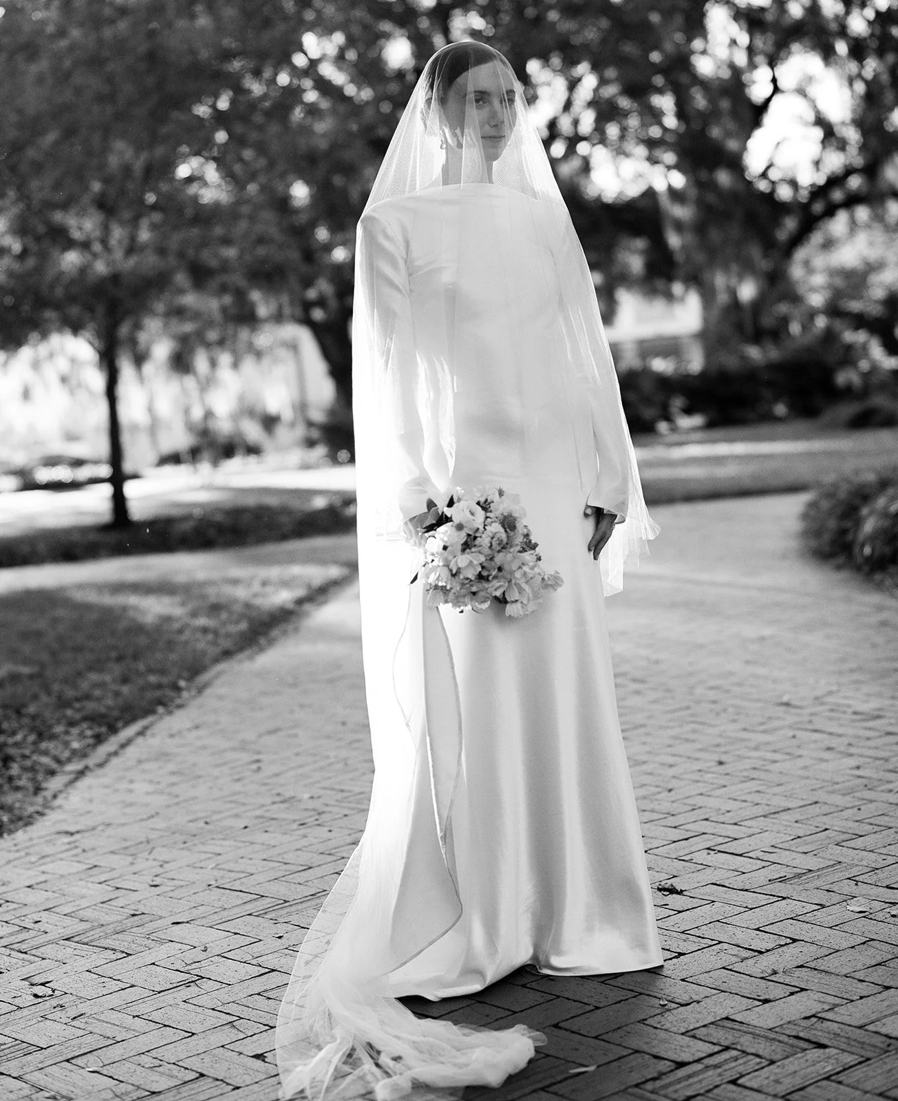 Bride poses for film portrait in Savannah, Georgia.
