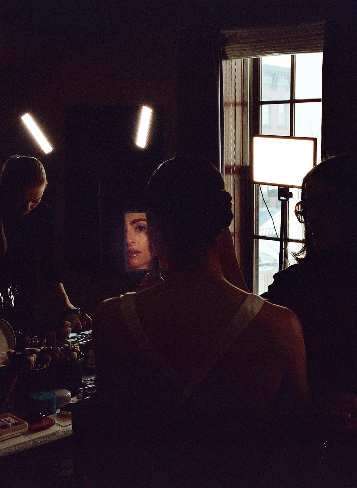 A bride gets ready at The Maker hotel in Hudson, New York at the beginning of her wedding day..