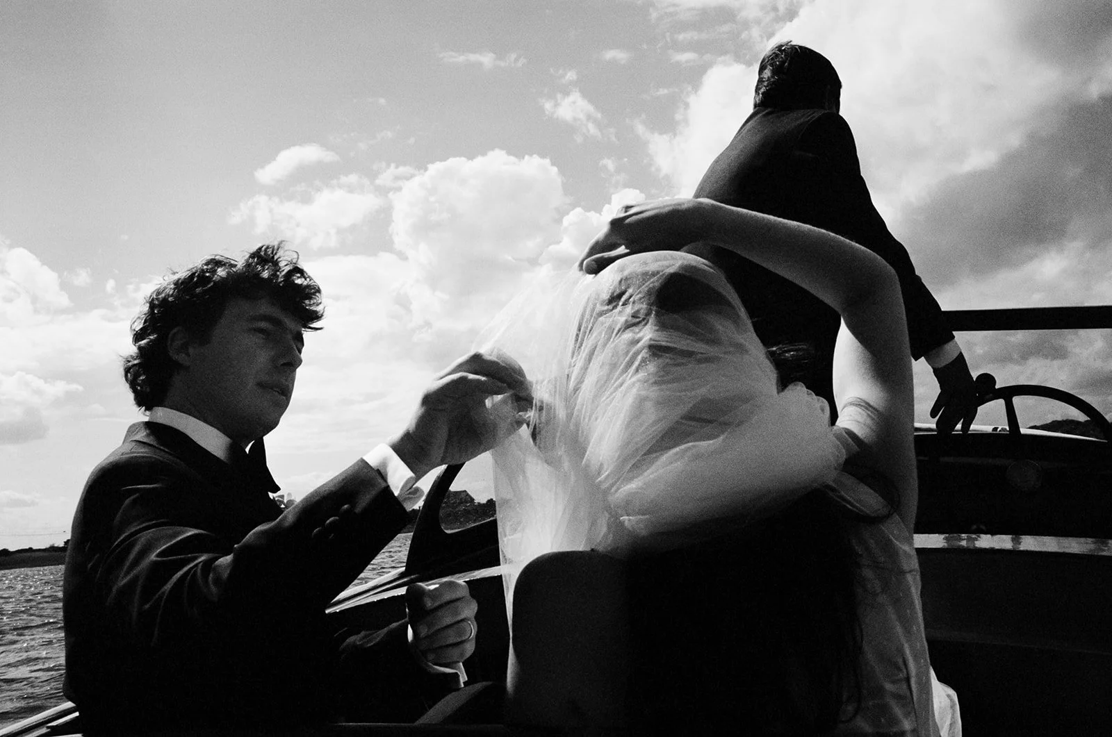 Couple takes a boat ride just after their wedding ceremony on Cape Cod in Massachusetts.