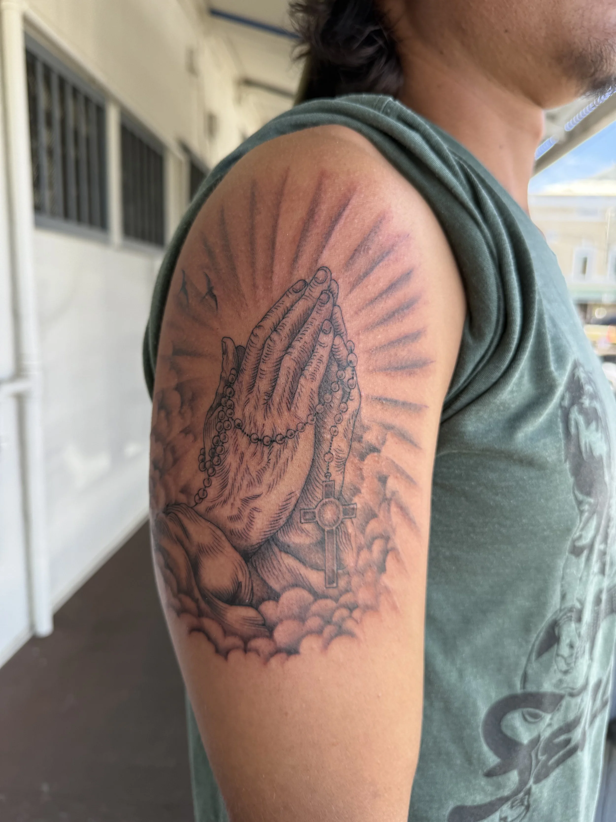 Prayer hands with rosary