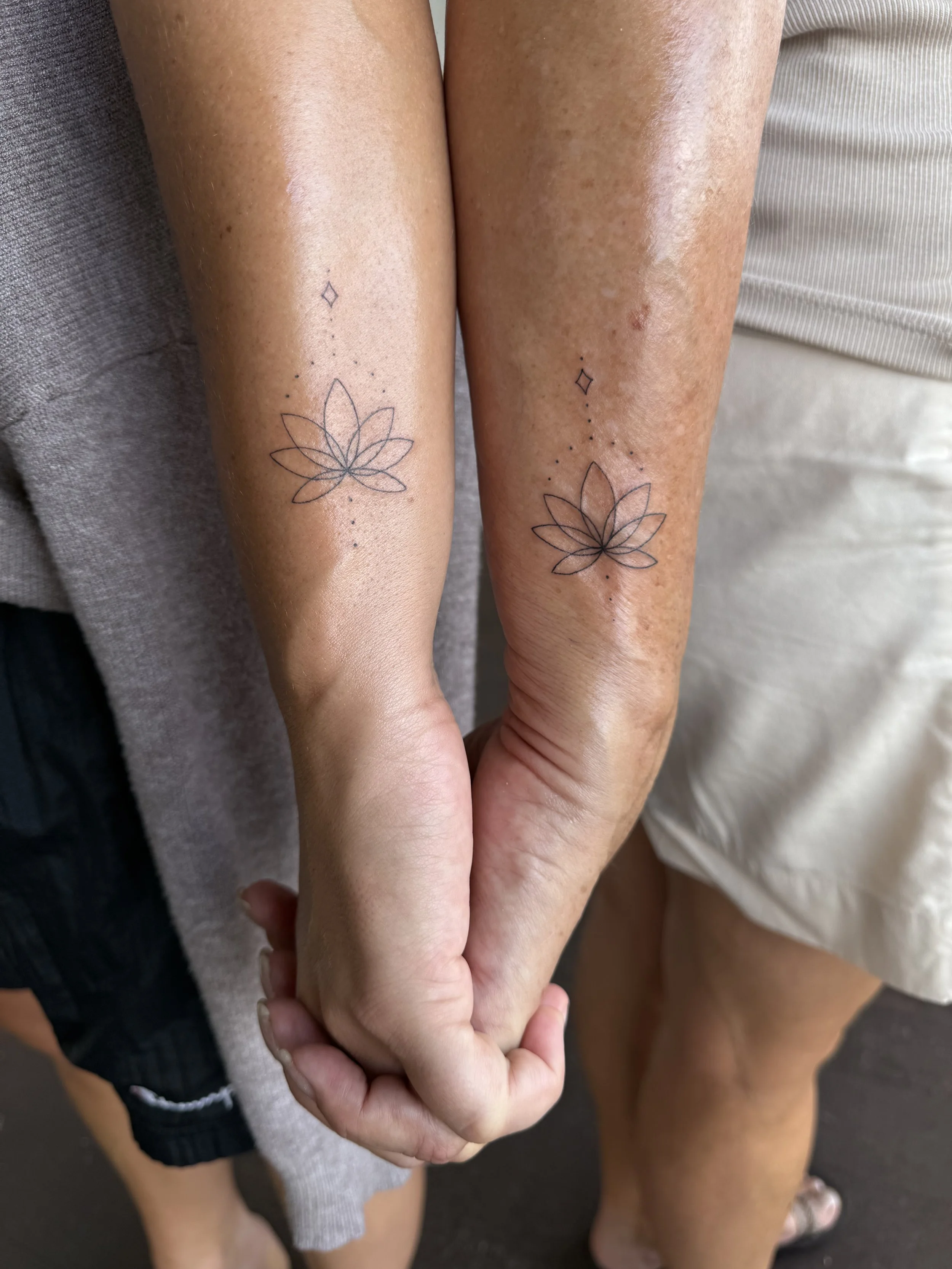 fine line matching lotus tattoos