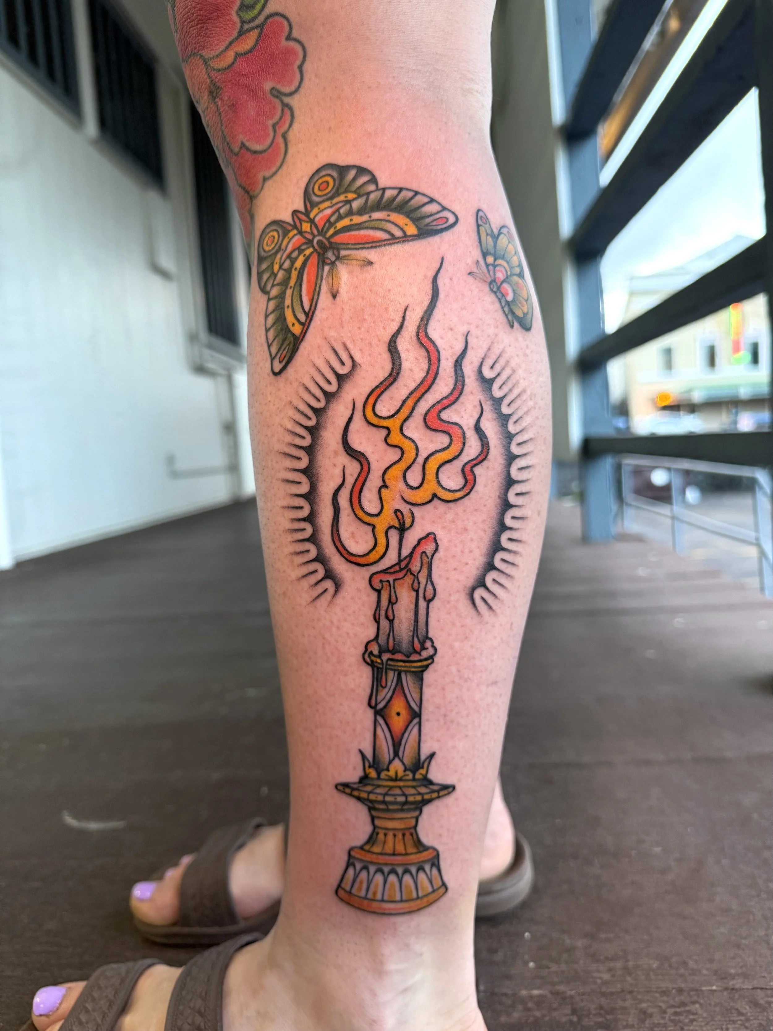 Like moths to a flame - moths and a flaming candle