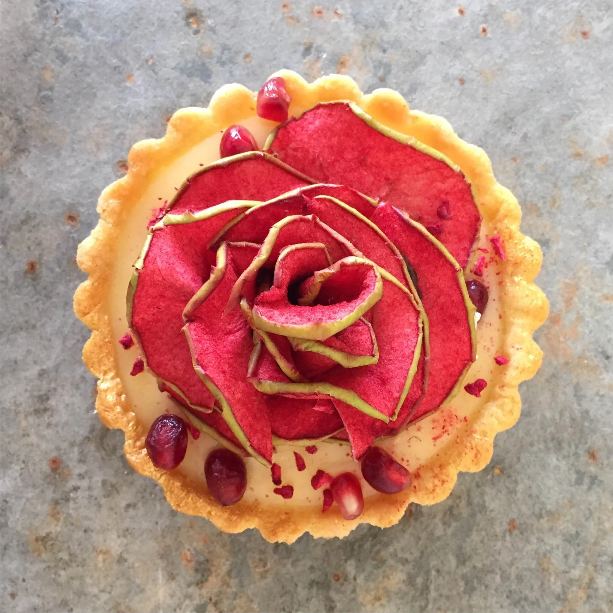 Raspberry, lemon & pomegranate apple rose tart