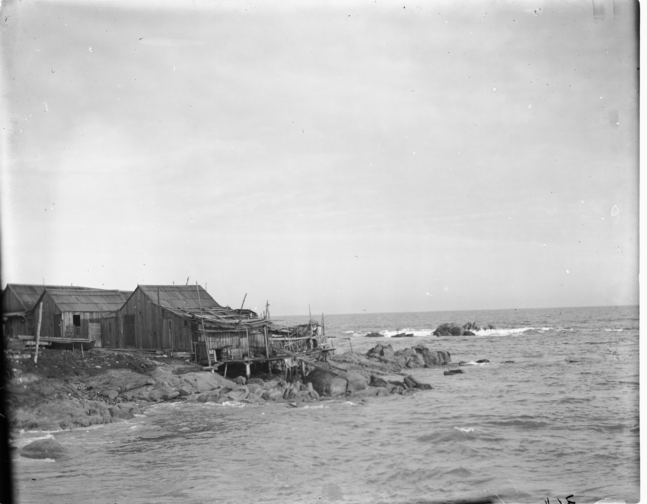 Wooden buildings at Chinese village, which was located near current site of Hopkins Marine Station (also known as Point Cabrillo and China Point) until 1906.