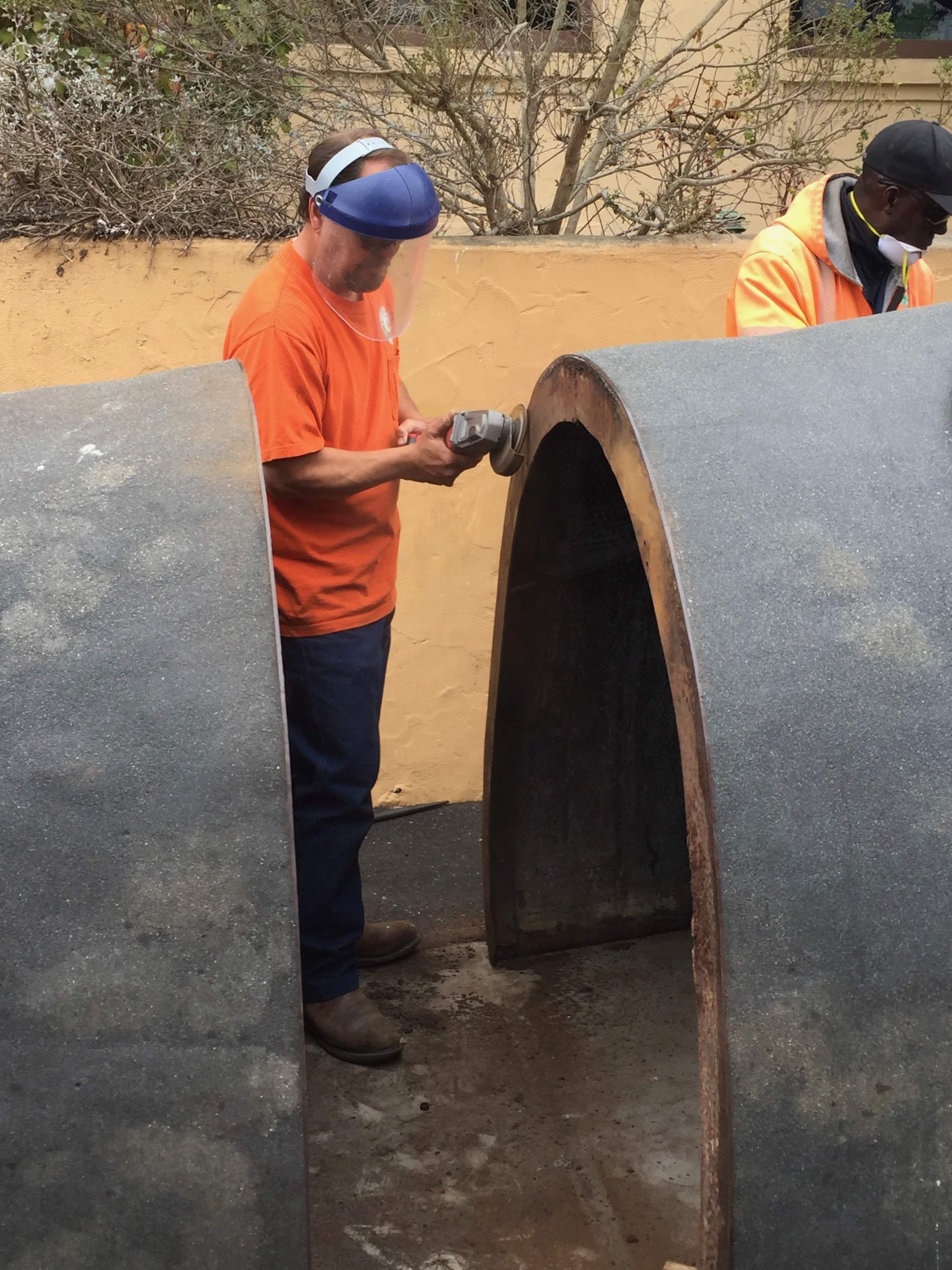Sections were detached. Koji Stewart and Sam Crosby sanded the frame edges.
