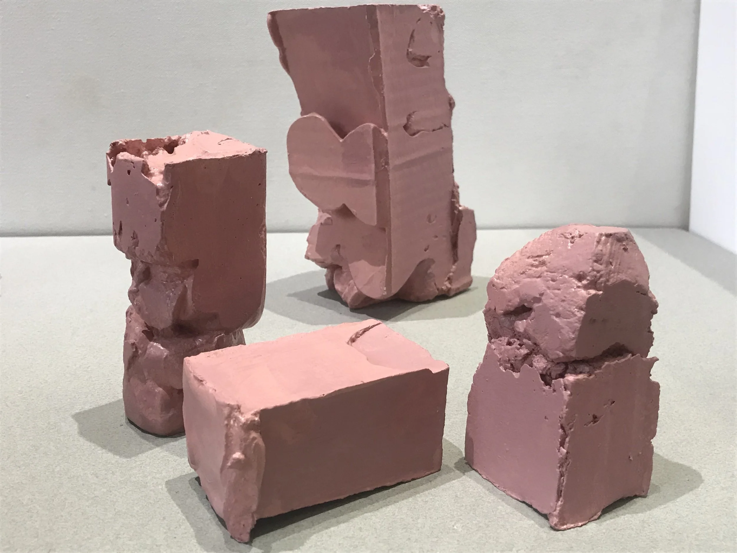 Flesh Packages, painted plaster, string collection of pieces each varying 6”H X4”W X 3”L (2018)