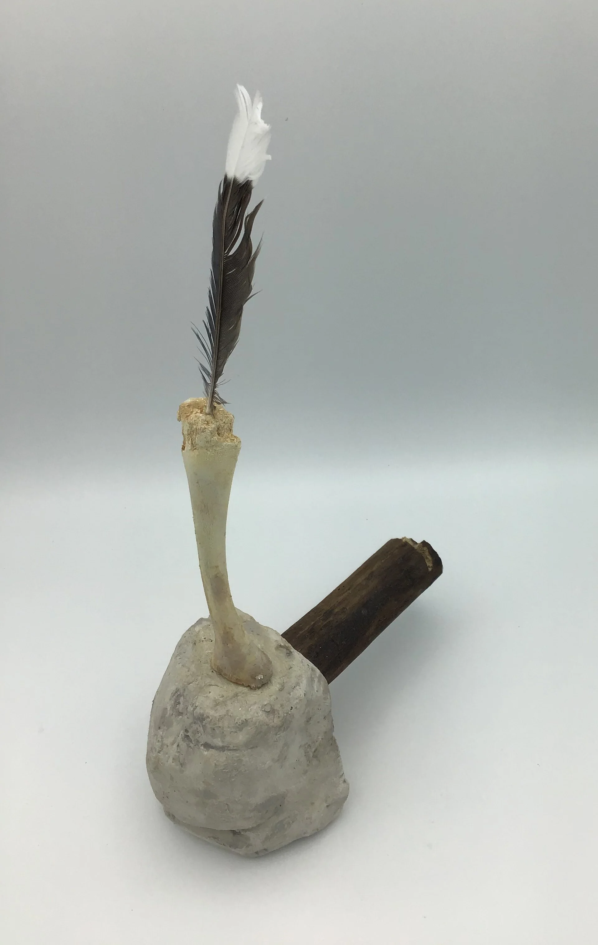 Chief , plaster, wood, bone feather, and glue, 13”H X3”W X 6.5”D (2020)