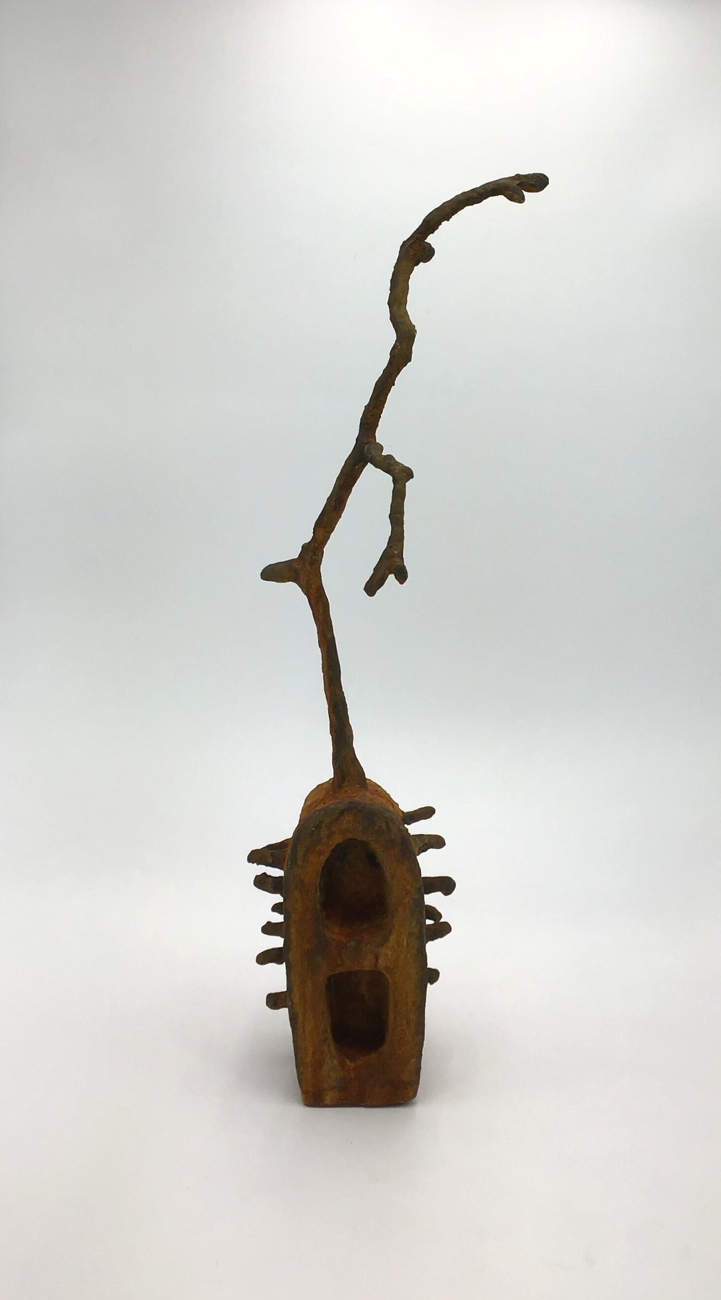 Root, styrofoam, tree branch, iron metallic paint with rust activator, 26”H X 8”W X 9”D (2021)
