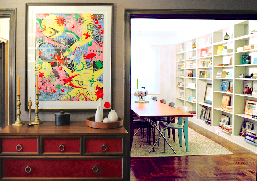 Pop artwork, red leather cabinet and greascloth wallpaper in entry foyer 