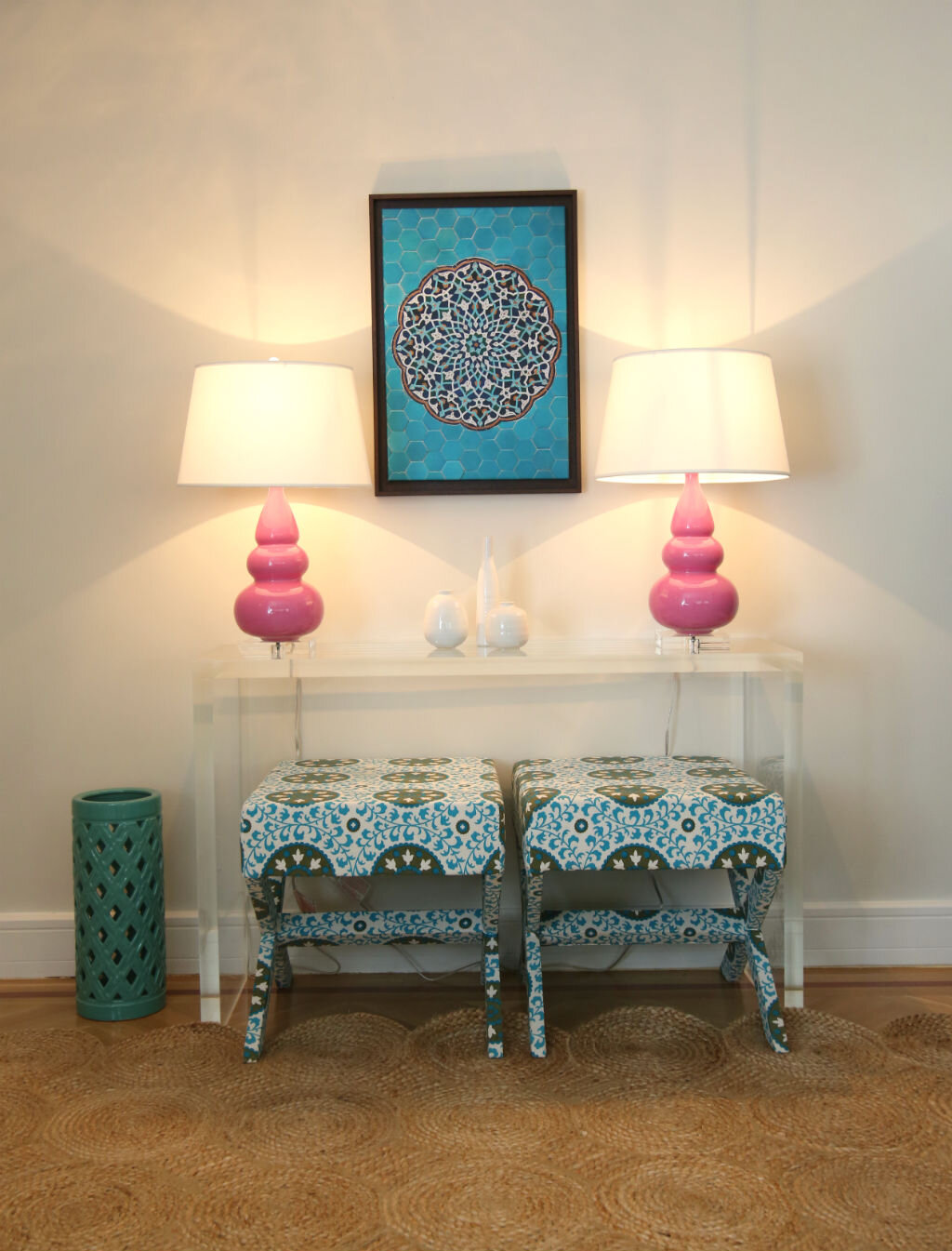 Pair of pink lamps and floral stools in entry 