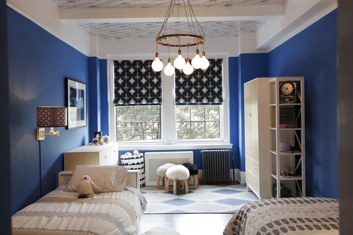 upper west side boys bedroom with geometric patterns and metallic wallpapered ceiling  