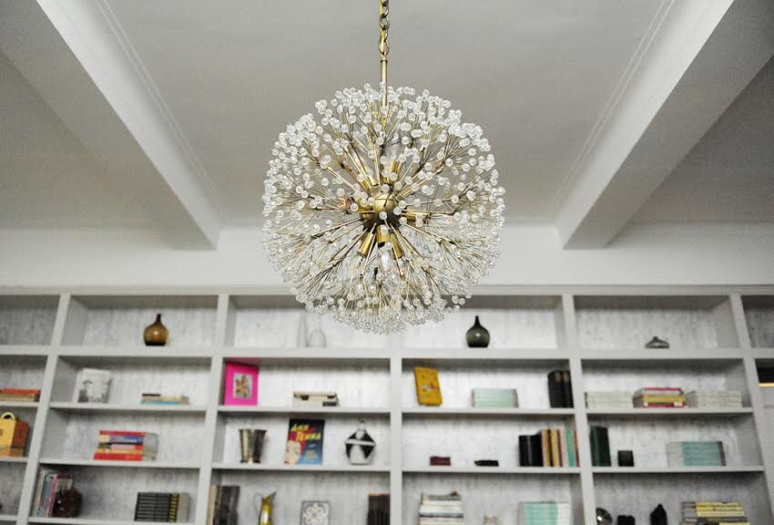 Crystal chandelier and custom Millwork with styled shelves in upper west side apt 