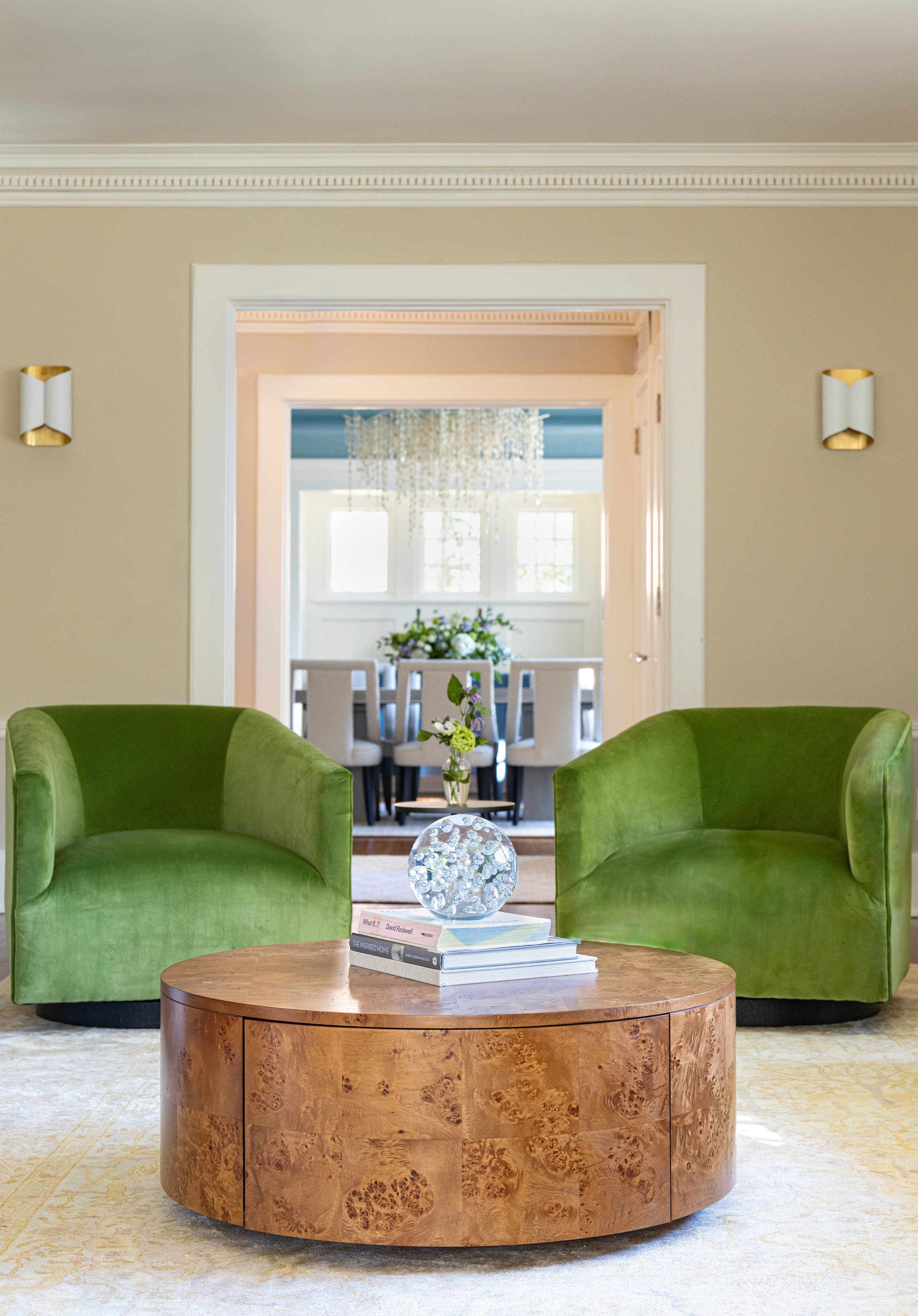 Montclair living room redesign with green chairs 