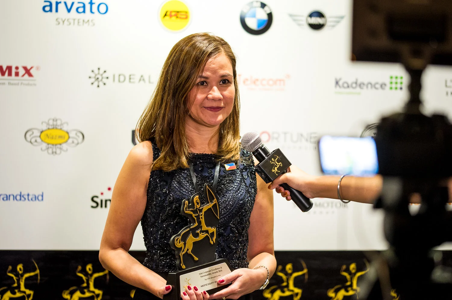 Malou L. Marasigan, AEV VP for Reputation Management, speaking to media