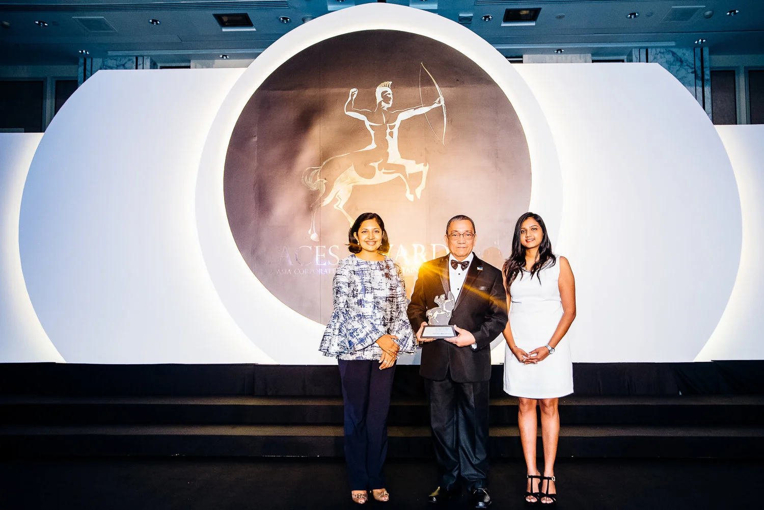 EDC Chief Finance Officer Nestor Vasay (center) receives a recognition for EDC as one of the top green companies in Asia.