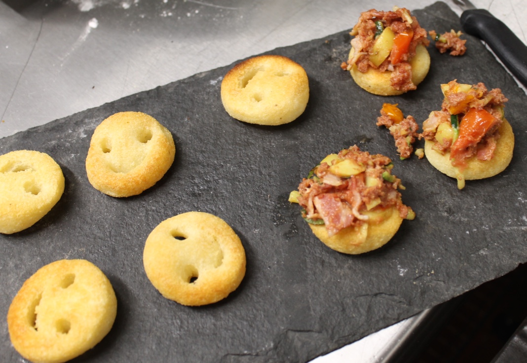 Corned beef hash on smiley faces