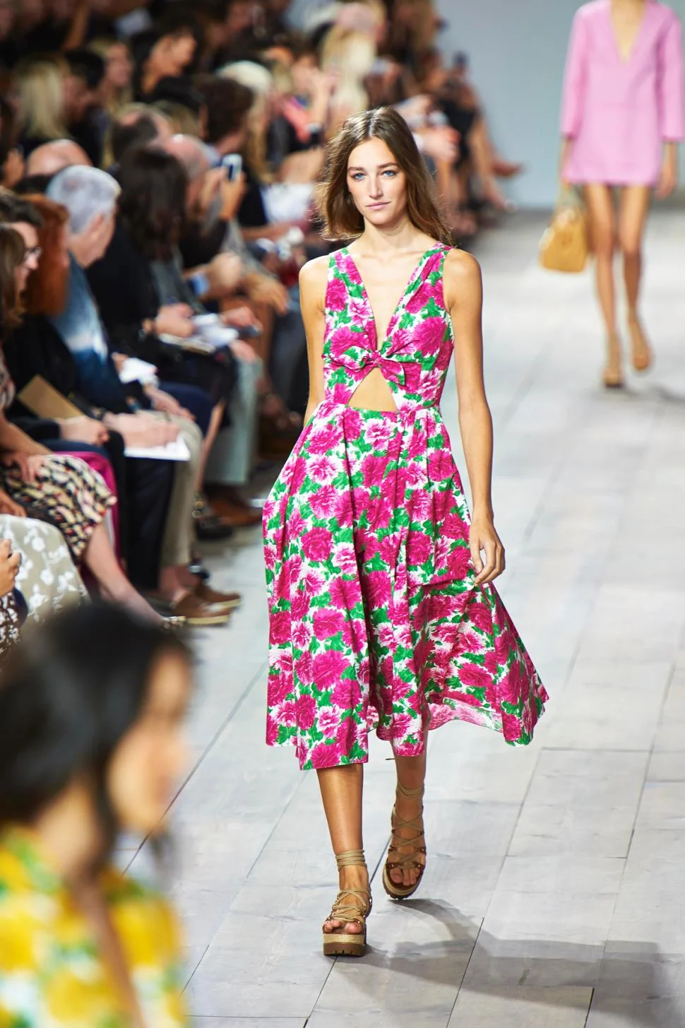 Michael Kors This dress is the definition of Spring with its flowery and colorful print. I could see this easily translating from day to night with the right accessories while on a vacation.