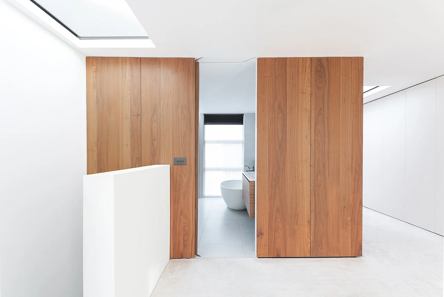 WilliamTozerAssociates_StructuralistEstates14_master-bedroom-walnut-wardrobe-ensuite.jpg