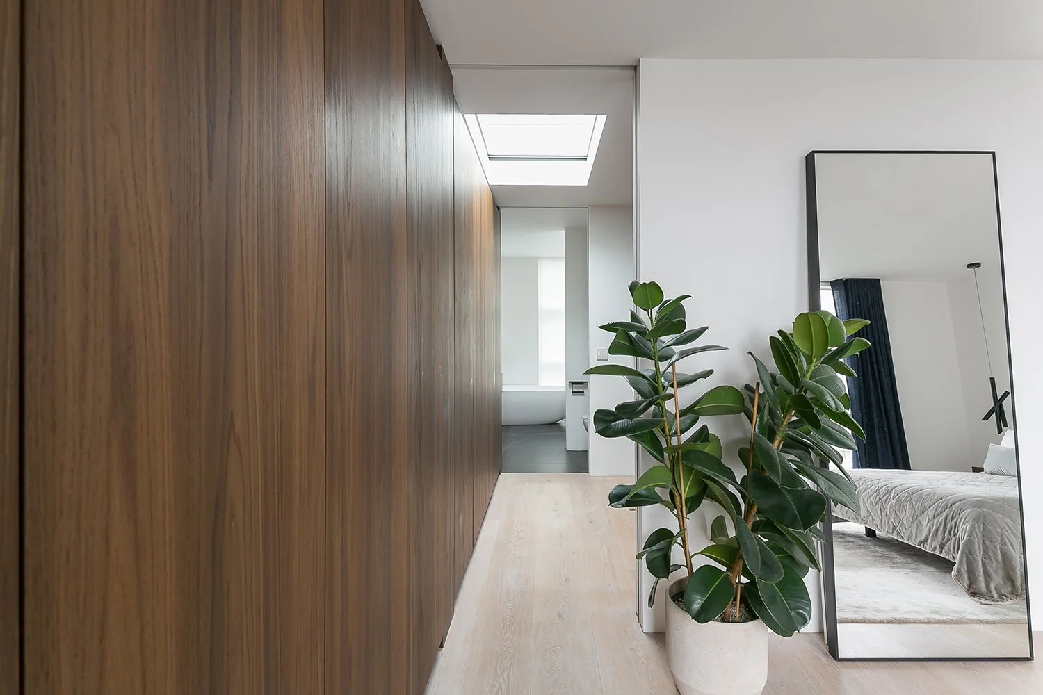 WilliamTozerAssociates_StructuralistEstates16_master-bedroom-timber-wardrobe-ensuite.jpg