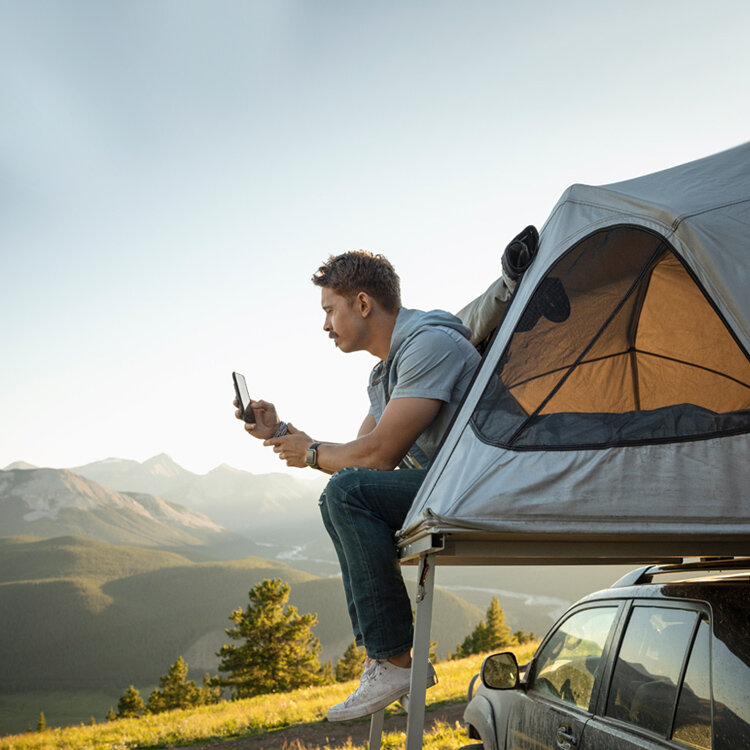 mc-hero-guy_camping_with_phone-750x750.desktop.jpg