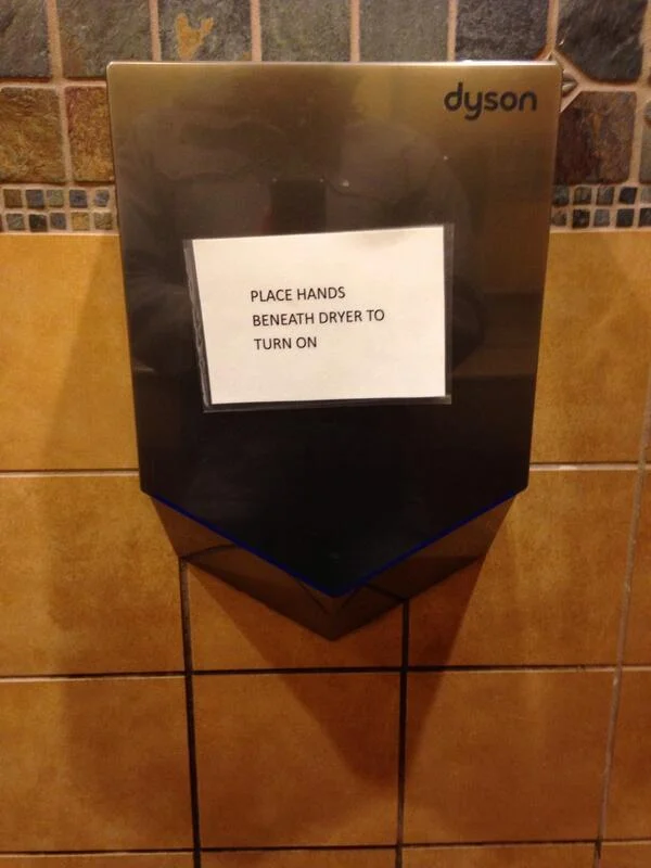 Broadly speaking, I’m a big fan of Dyson’s approach to product design. But I came across this in a Wegman’s recently, and it’s a great example of the fine line between design for design sake, and design for usability.
If users of the product need to cover the beautiful design with a sign informing people how to use it, the design is a failure.