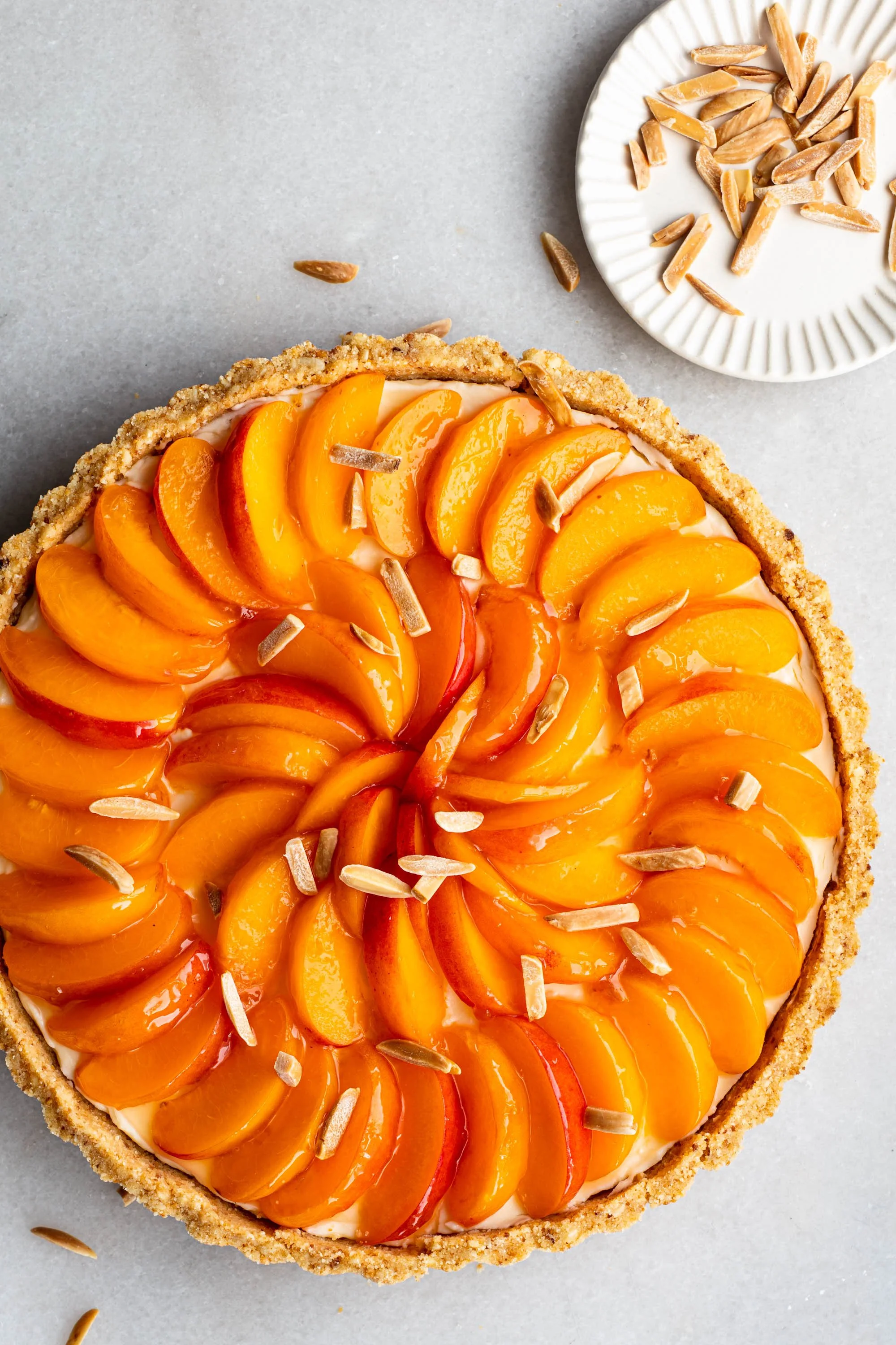Peach tart with slivered almonds on top