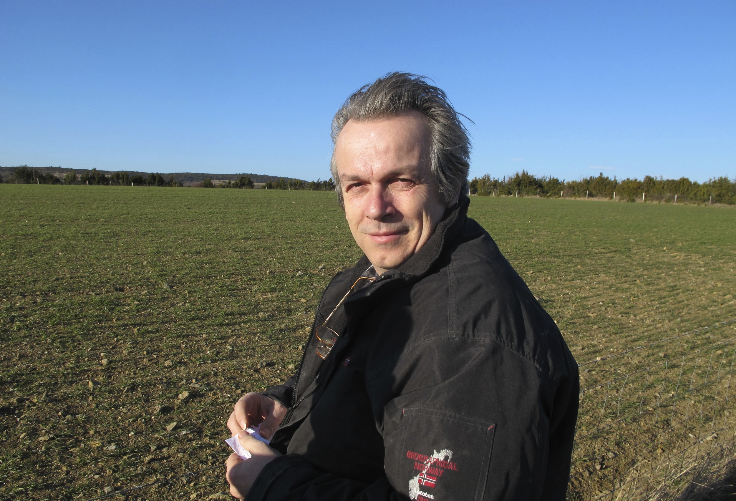 Ronald Feuillas in front of a young field of ancient wheat in southwest France