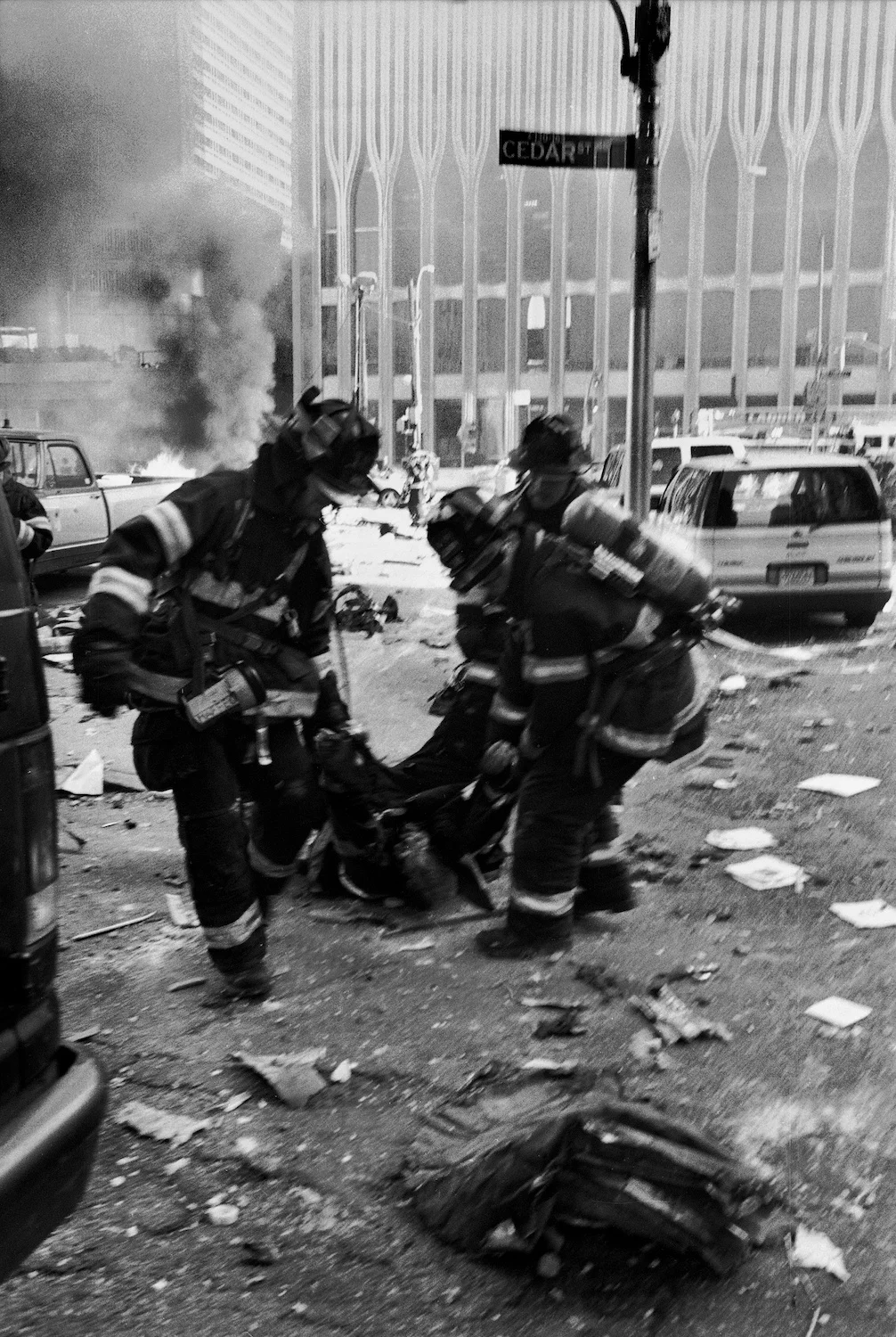 Firemen carrying victim of the fall