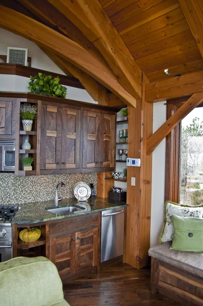 Crafted of Claro Walnut, these kitchen cabinets have live edge stiles and rails.