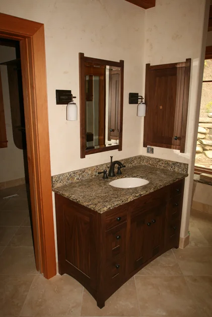 FSC Certified walnut vanity, mirror, and medicine cabinet.