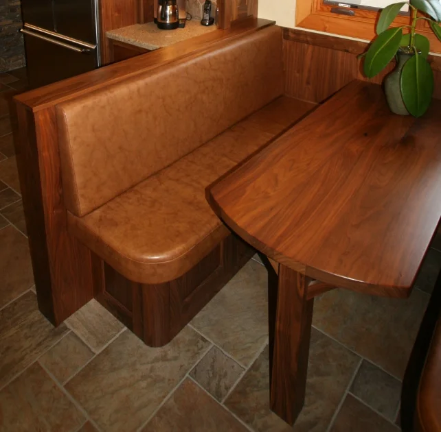 Walnut booth seating and table in breakfast nook.