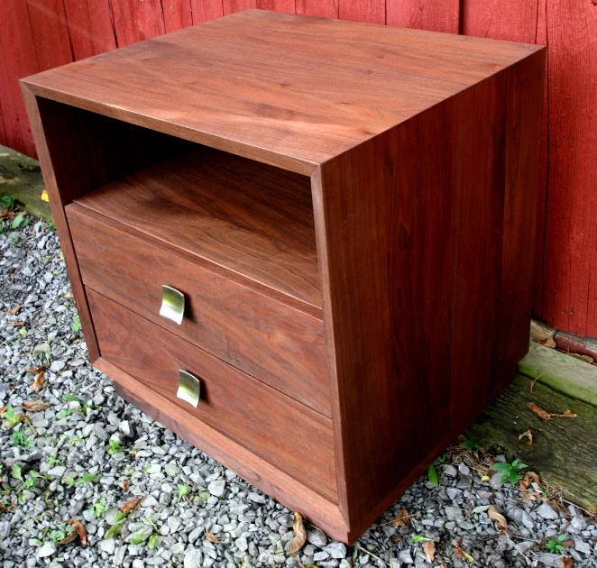 This custom end table/night stand uses a more contemporary design accented with contemporary drawer pulls.