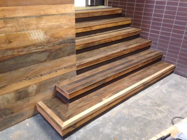 Reclaimed Settlers' Plank Mixed Hardwoods stairs and siding.