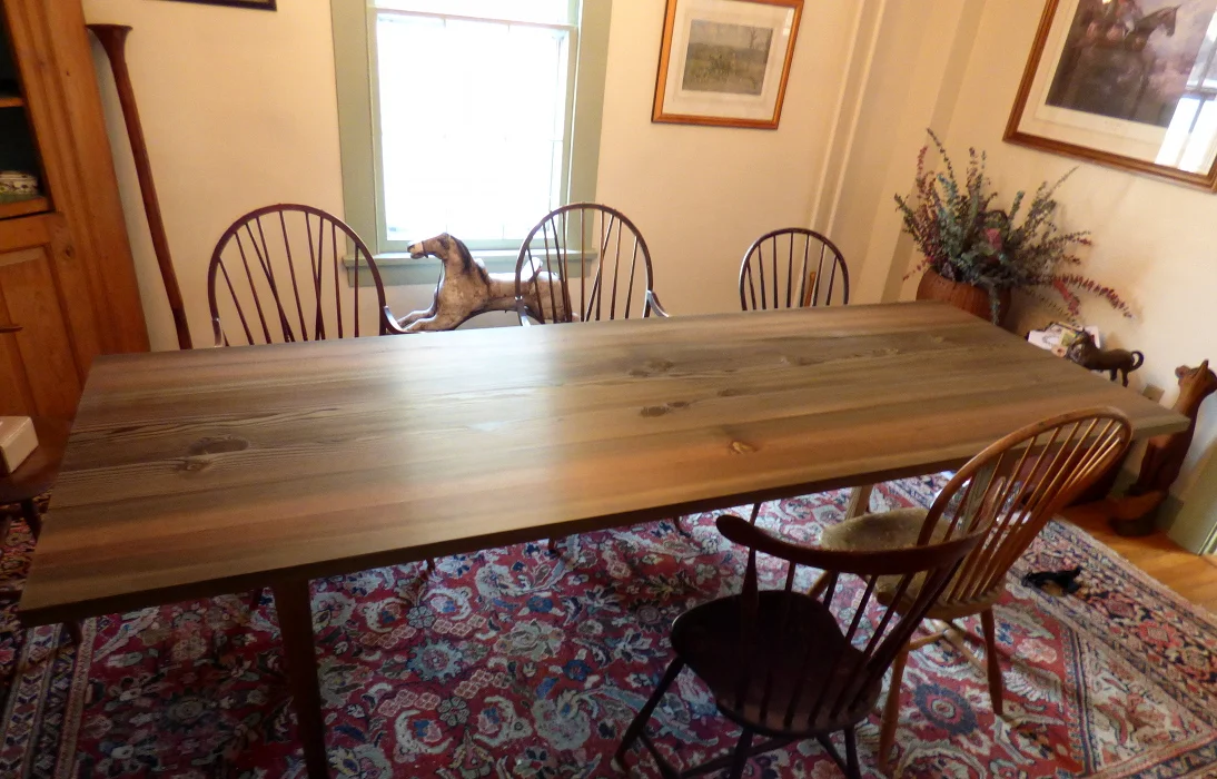 Reclaimed Douglas fir dining table with hand wiped oil finish comfortably seats eight.