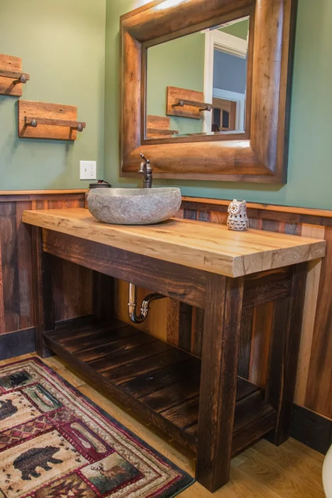 Powder room vanity topped with a large slab of reclaimed elm sitting on "toasted" reclaimed oak base.