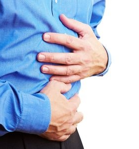 Man with hands on abdomen - Ultimate Health Personal Training Center Toluca Lake