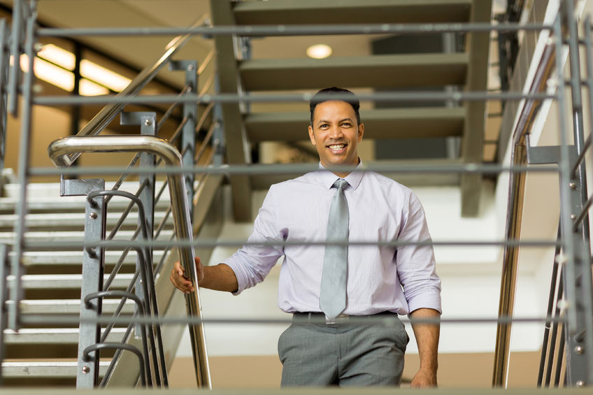 Business man walking up staircase-Ultimate Health - Personal Trainer Hollywood - Studio City