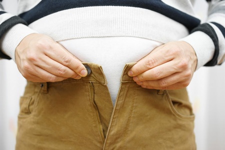 Man Can't button too tight pants