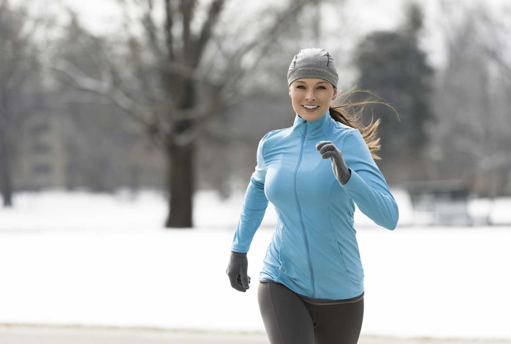Woman running in snow