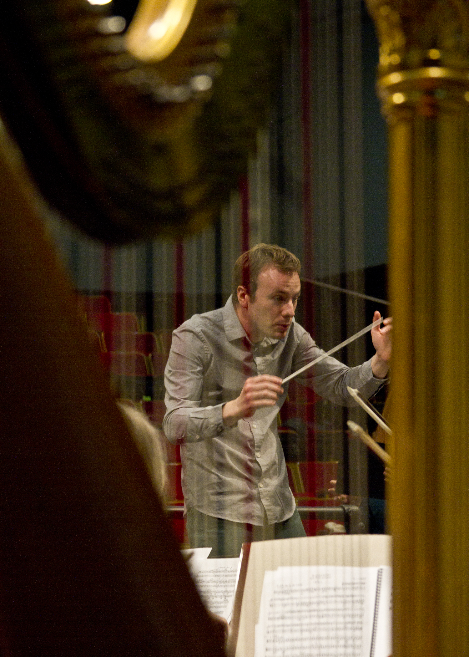 Conductor Wesley Schulz leads the Bainbridge Symphony Orchestra through a practice session. 