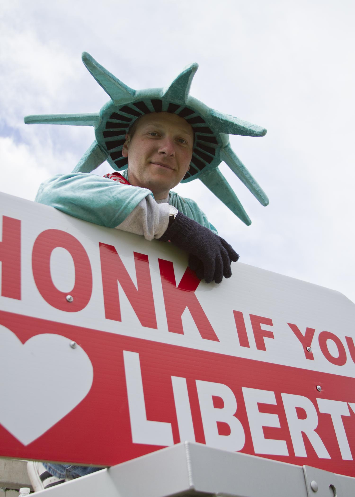  A man poses while taking a break from spinning a sign advertising a tax service company in Poulsbo, Washington.&nbsp; 