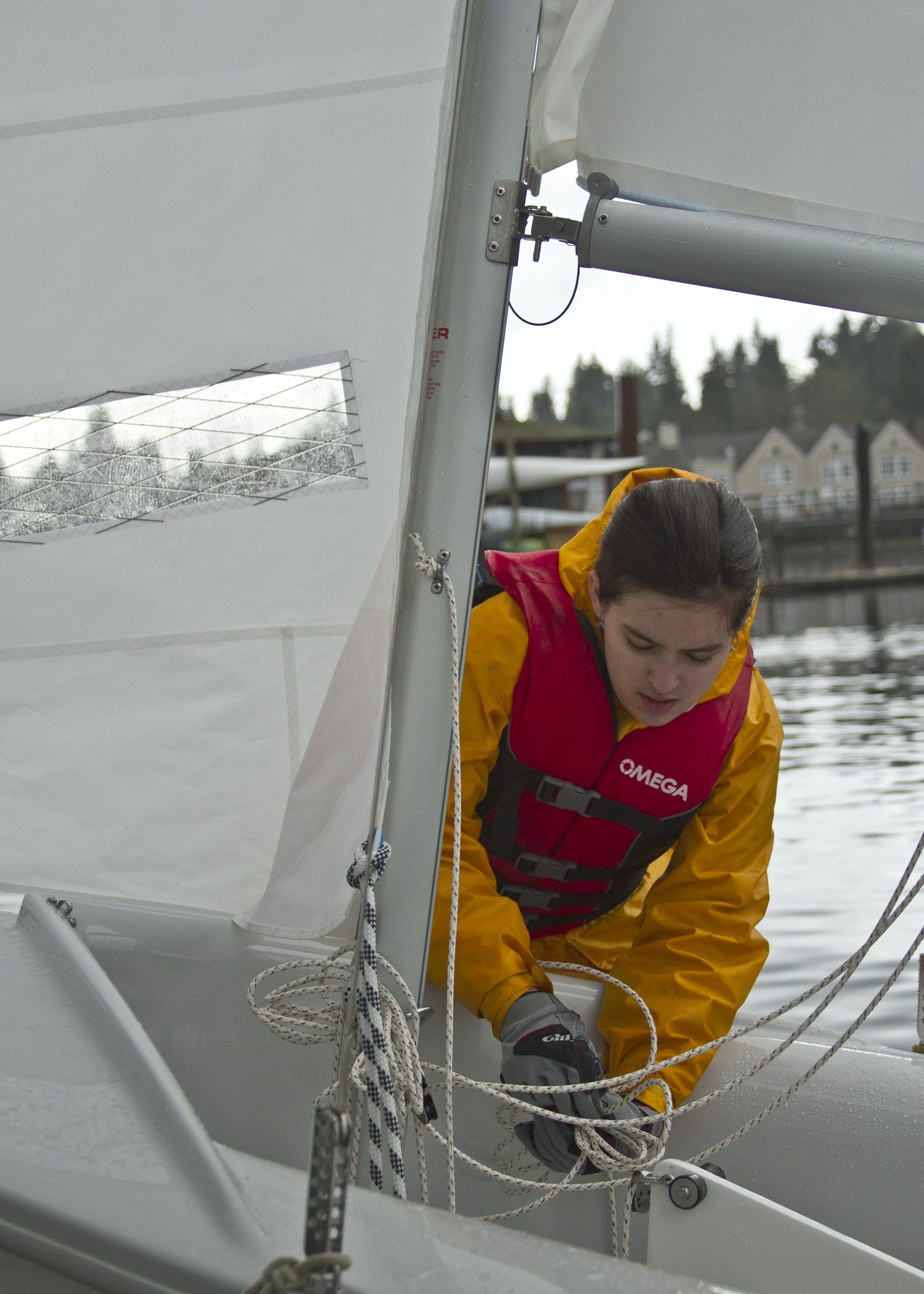 Bainbridge High School freshman sailor Diana Curtis prepares her boat to be put into the water during the team's second practice session of the 2013 season. 