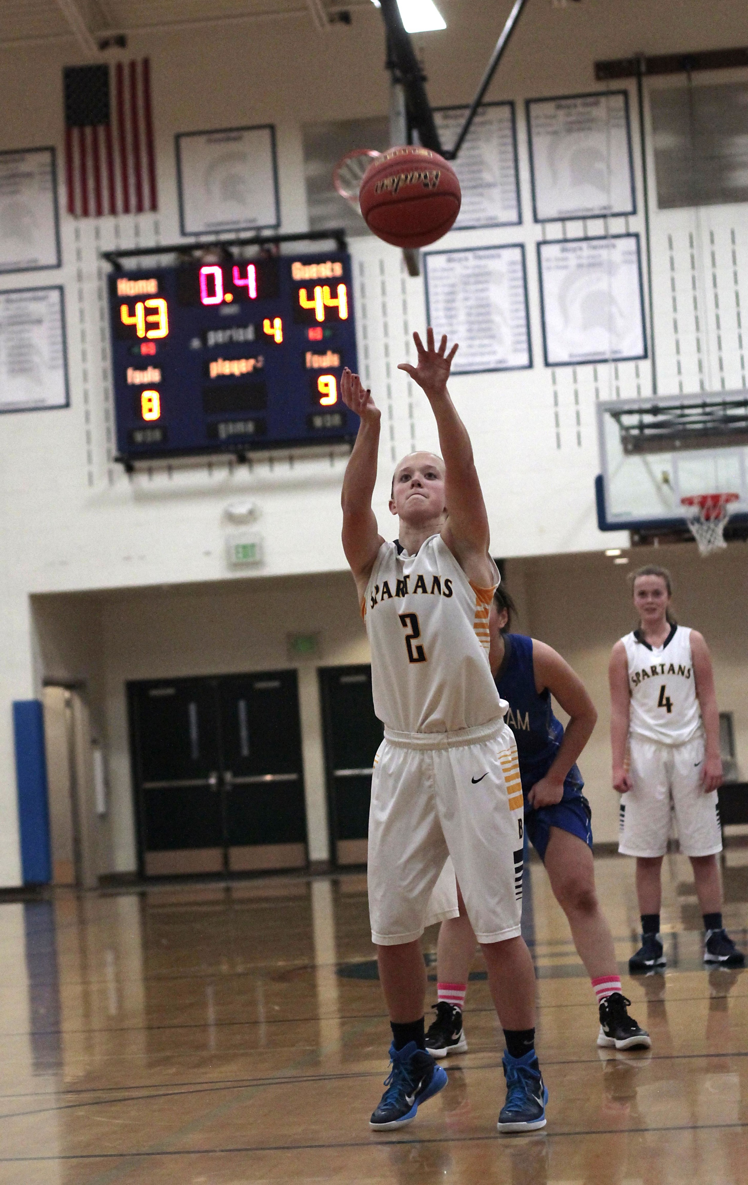  Bainbridge High School senior guard Paige Brigham attempts a free throw that tie the team's first 2015 postseason outing with less than half a second of play remaining.&nbsp; 