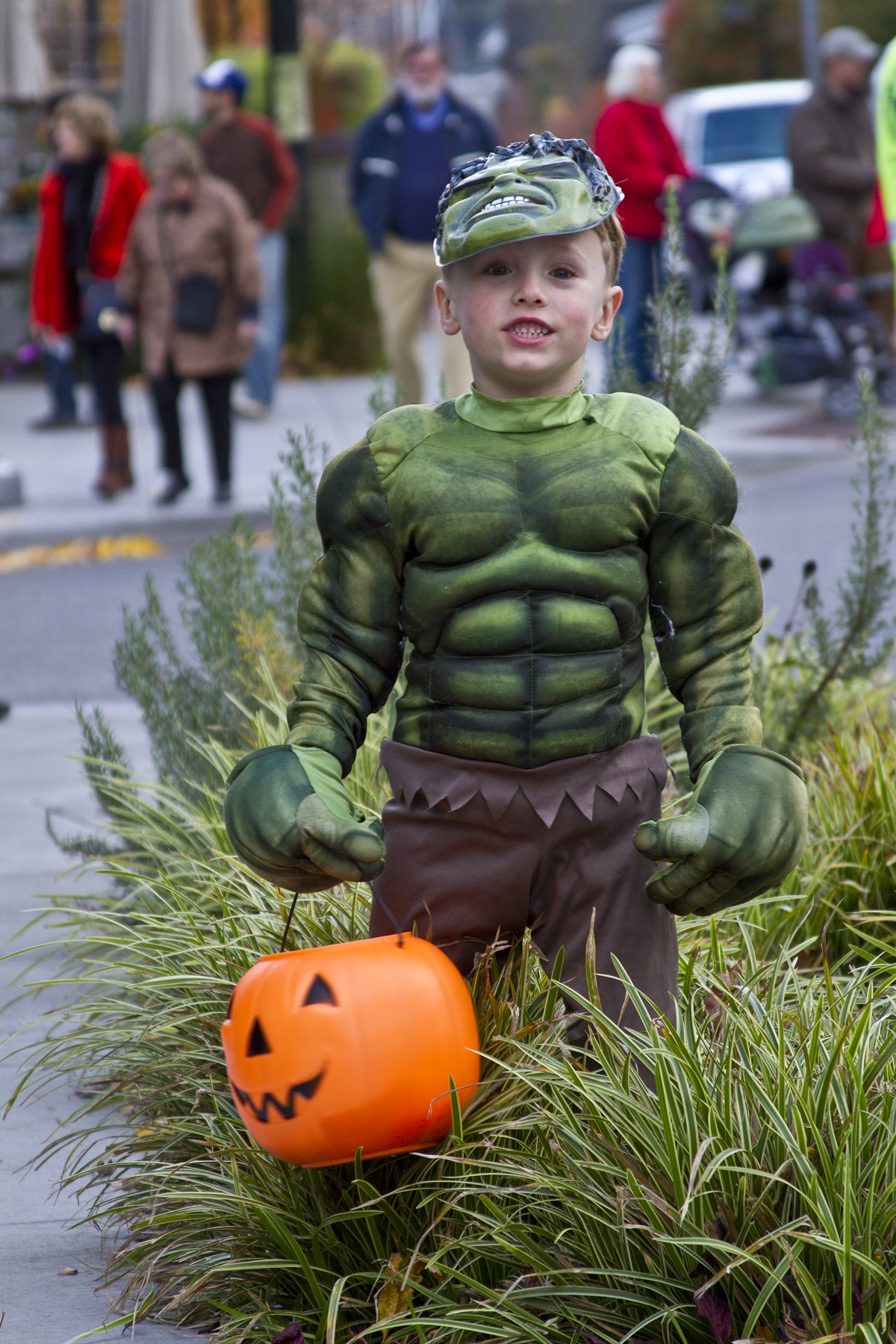  One young trick-or-treater, dressed as the Incredible Hulk, takes a quick break to pose during the 2013 downtown Winslow Trick Or Treat event on Bainbridge Island.&nbsp; 