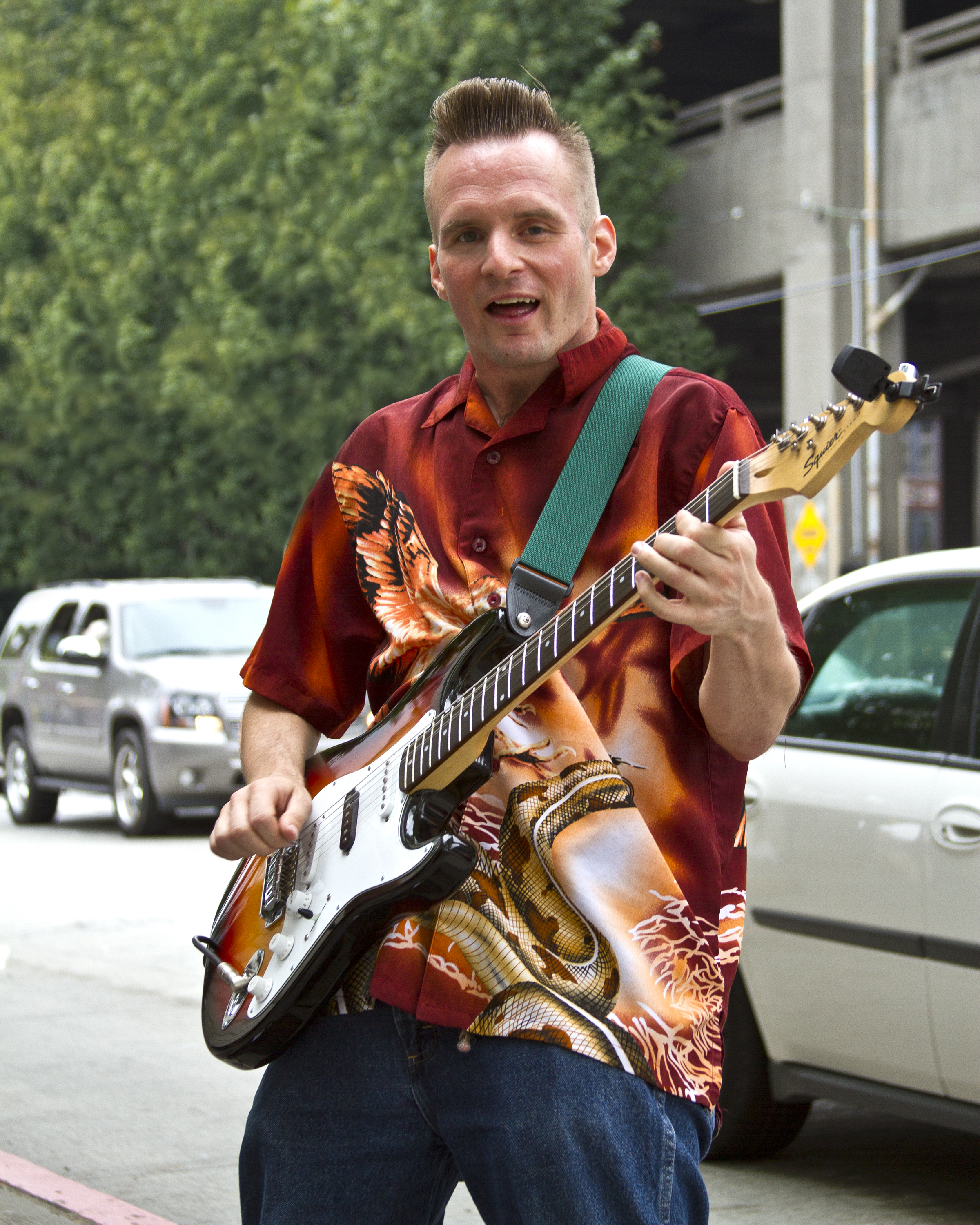  A man plays guitar on Alaskan Way in downtown Seattle.&nbsp; 