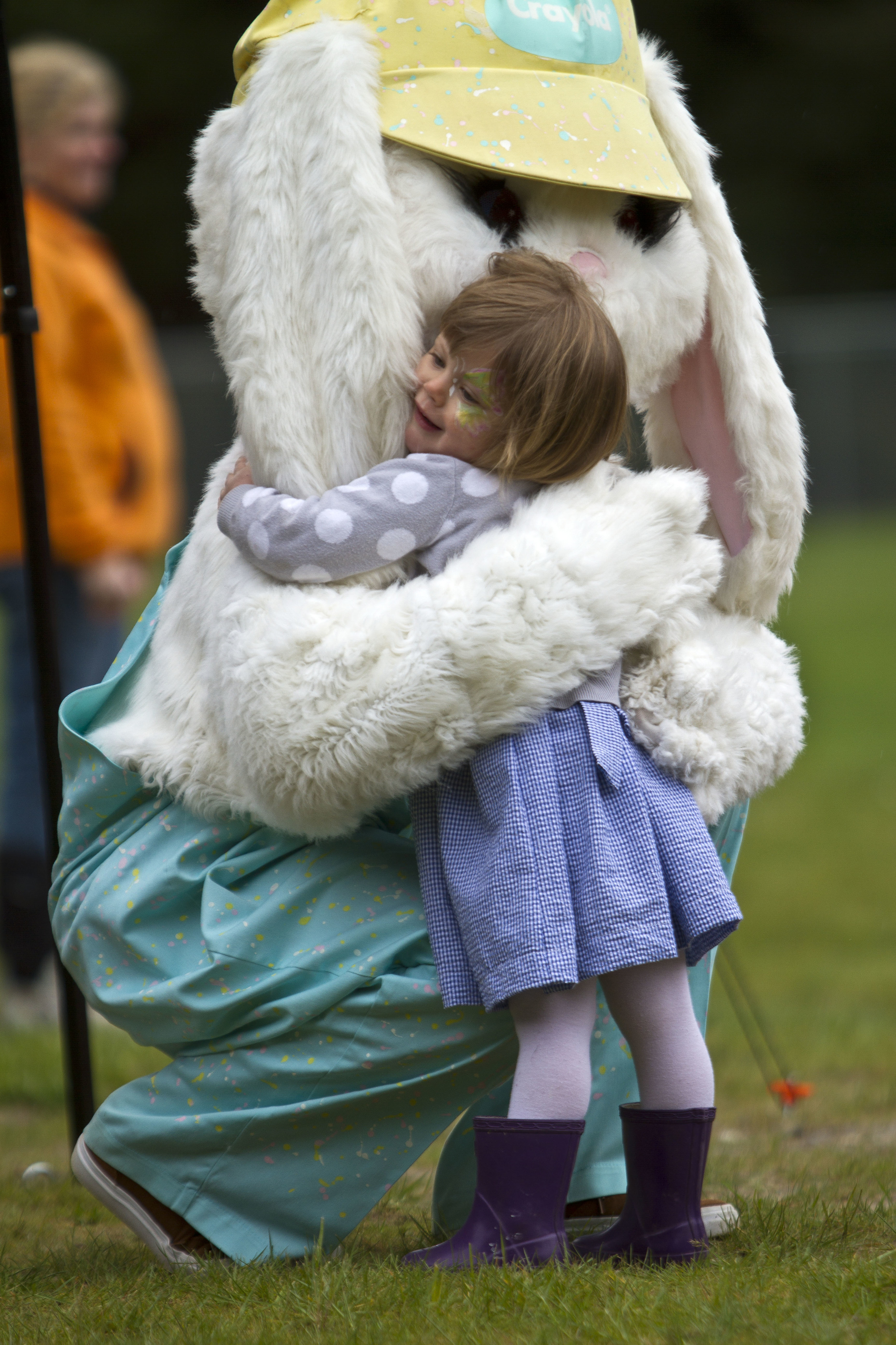 Frankie Rohan, 2, gives the Easter Bunny a big hug at the annual Easter egg hunt at Strawberry Hill Park Saturday. 