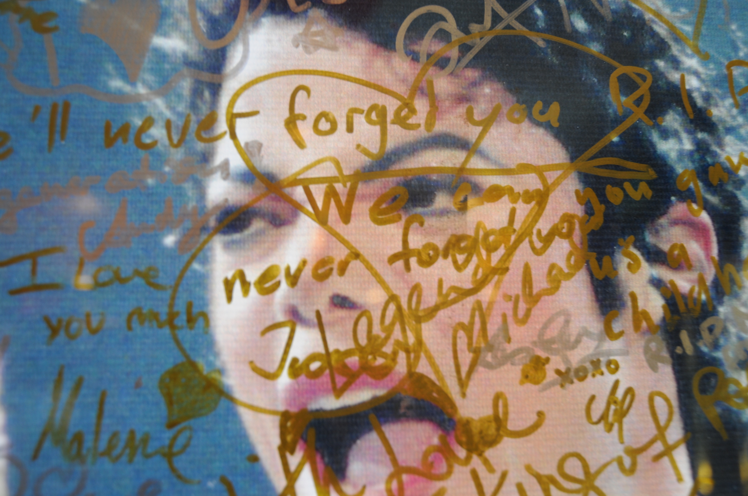  A poster outside of a Hard Rock Cafe in Singapore, marked with the memorial messages of fans.&nbsp; 