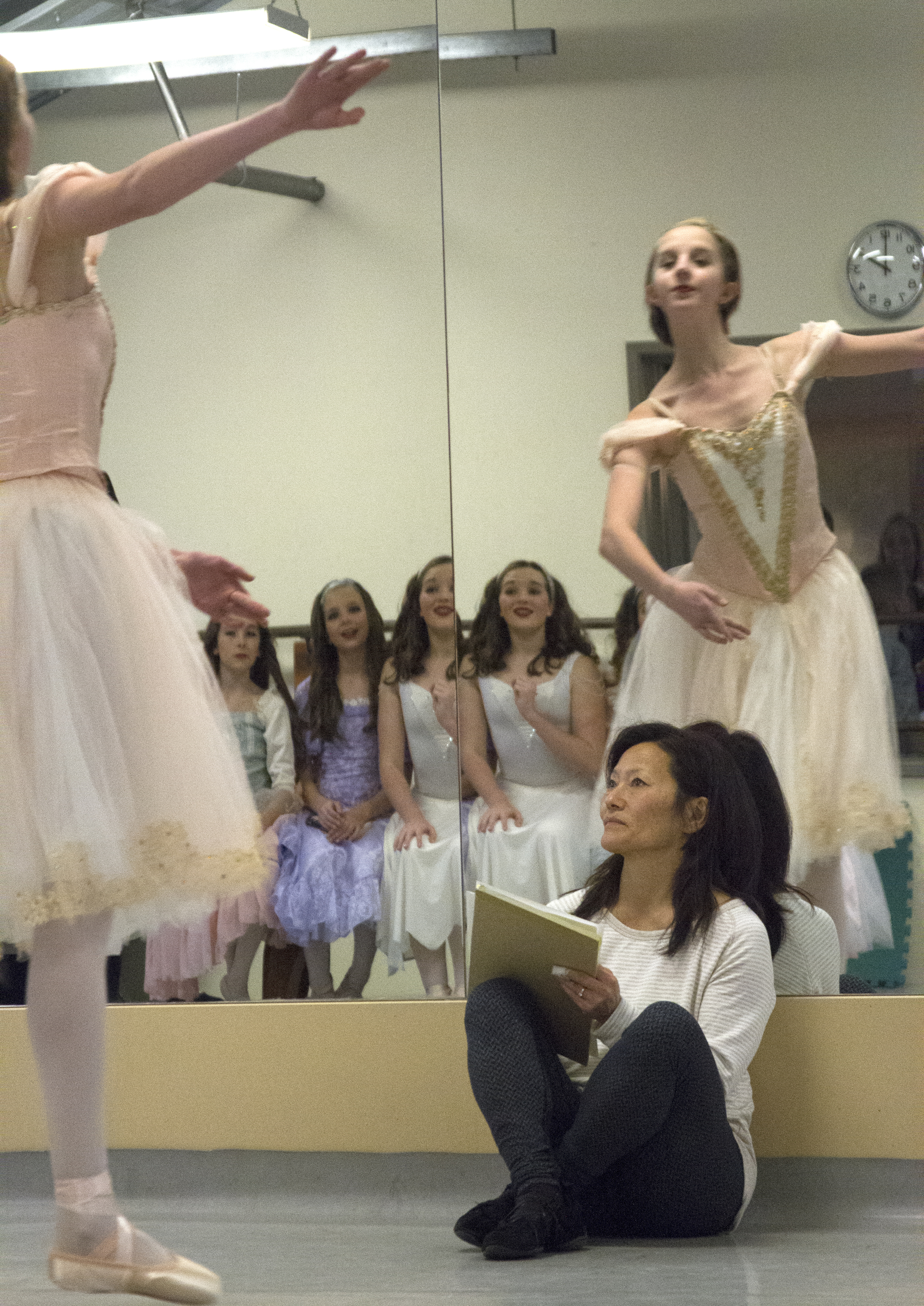 Sara Cramer, founder of Olympic Performance Group watches a practice session of a recent production of “The Nutcracker." 